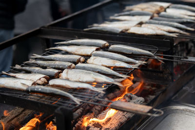 High angle view of fish on barbecue grill