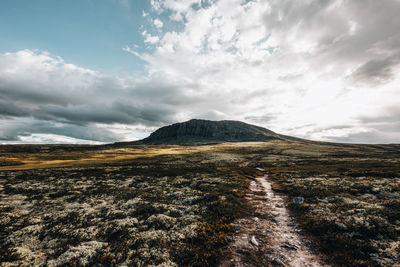 Scenic view of landscape with mountains against sky