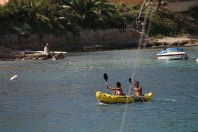 People on boat in sea