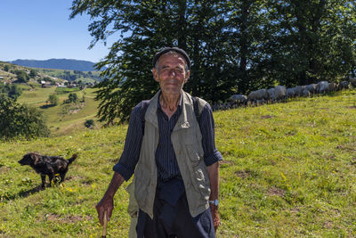 Portrait of a man standing on field