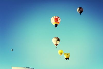 Low angle view of hot air balloons against sky