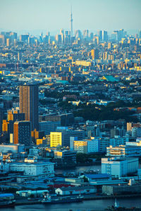 High angle view of buildings in city against sky at dusk