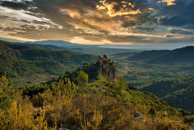 Scenic view of landscape against sky during sunset