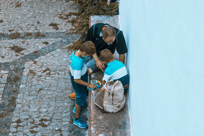 High angle view of people on wall