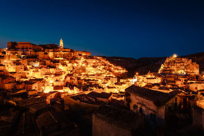 City of matera from piazzetta pascoli at night with illuminated houses