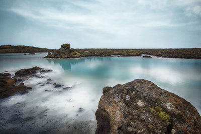 View of calm lake against the sky