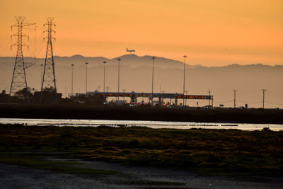 Scenic view of sea against orange sky