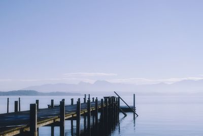 Pier on sea against sky