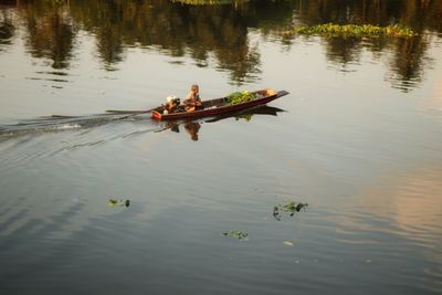 High angle view of people in boat on lake