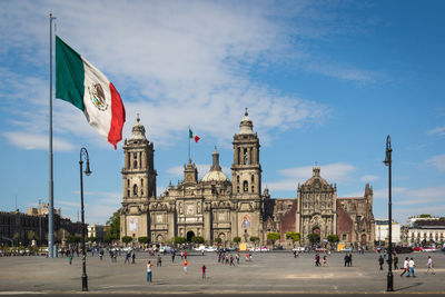 Group of people in front of buildings in city