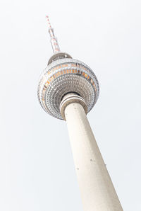 Low angle view of communications tower against sky