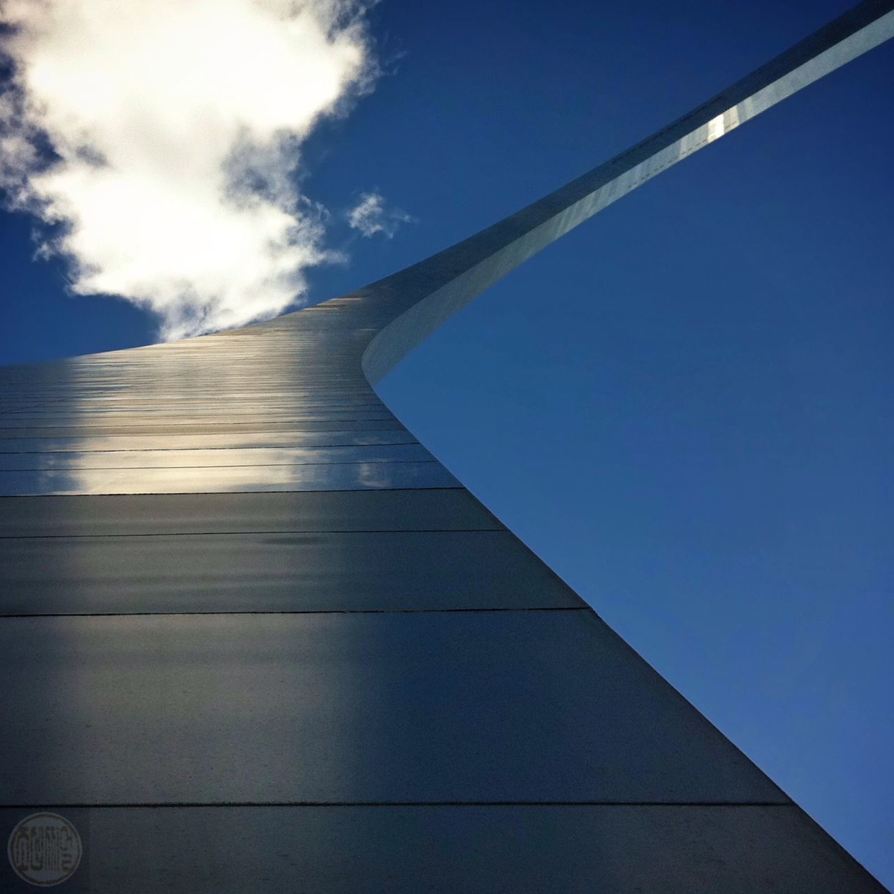 architecture, built structure, low angle view, building exterior, blue, sky, modern, day, no people, outdoors, sunlight, office building, building, cloud, city, reflection, clear sky, tall - high, tower, diminishing perspective