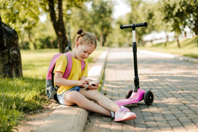 Portrait of young woman exercising in park