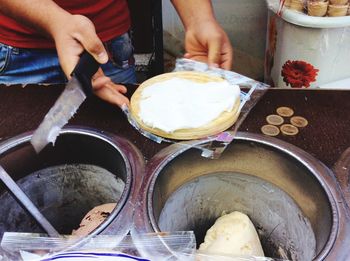 Cropped hand holding food