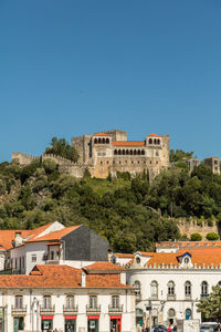 Low angle view of fort against blue sky