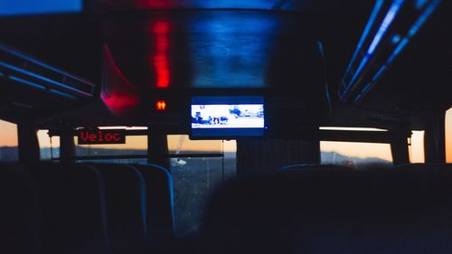 Train at illuminated railroad station