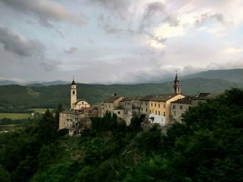 Castle on mountain against sky