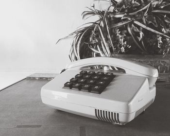 Close-up of telephone on table