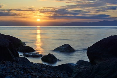 Scenic view of sea against sky during sunset