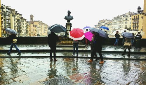 People on wet street in rainy season