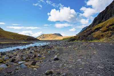 Beautiful close-up view of stream flowing at seljavellir against sky