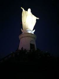 Low angle view of statue at night