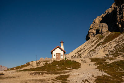 Low angle view of building against clear blue sky