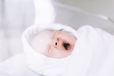 Portrait of cute baby girl lying down