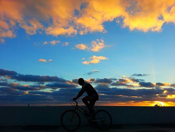 Silhouette of people at sunset