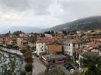 Buildings in town against sky