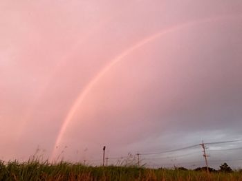 Scenic view of rainbow against sky during sunset