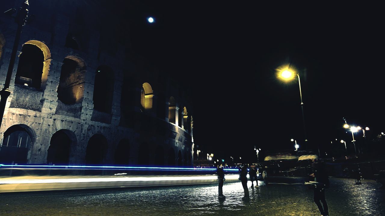 night, built structure, architecture, illuminated, arch, building exterior, history, water, famous place, transportation, travel destinations, travel, tourism, international landmark, clear sky, architectural column, street light, ancient, sky, bridge - man made structure