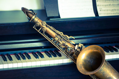 Close-up of piano and saxophone indoors