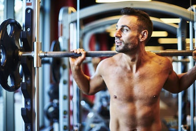 A man working out at the gym.