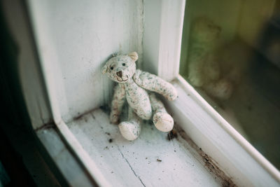 High angle view of teddy bear on window sill