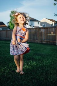 Girl playing on grass