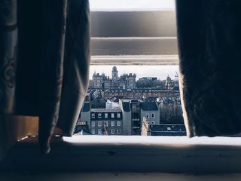 Close-up of cityscape against window