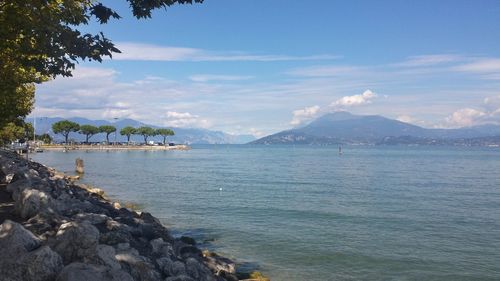 Scenic view of sea against cloudy sky