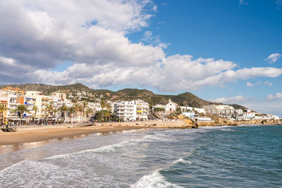 City by sea against sky