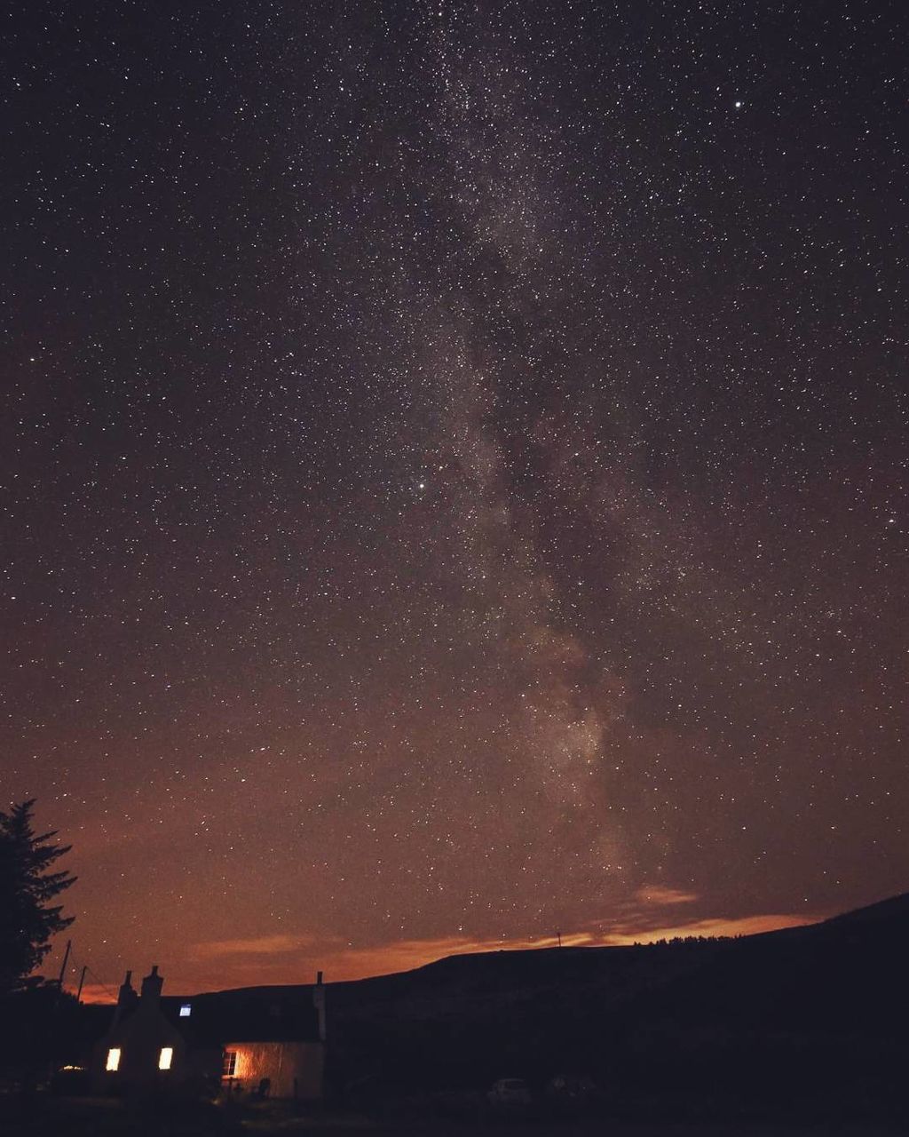 SCENIC VIEW OF ILLUMINATED STAR FIELD AT NIGHT