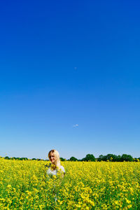 Scenic view of field against clear sky