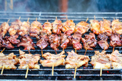 Close-up of meat on barbecue grill
