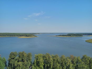 Scenic view of sea against blue sky