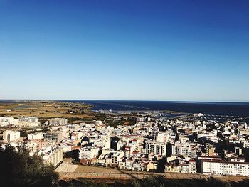 High angle view of townscape against clear blue sky