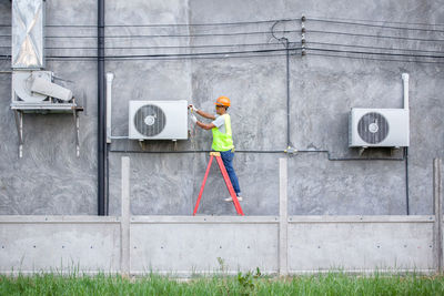 Man repairing air conditioner