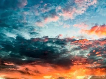 Low angle view of dramatic sky during sunset