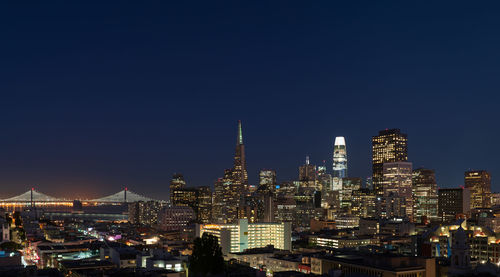 Illuminated buildings in city at night