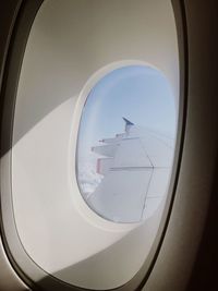 Airplane seen through glass window