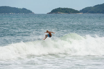 Man surfing in sea