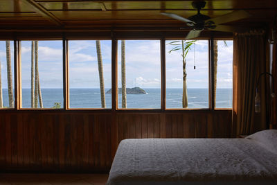 Views of the sea from inside the wooden bedroom through the windows